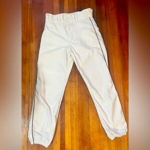 White tapered baseball pants with black piping (Tweeners).